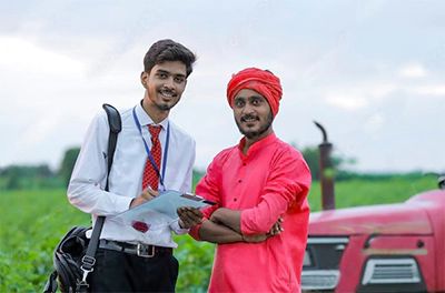 Farmer Standing Next to an Engineer 